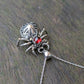 Garnet, Sterling Silver and 9ct yellow Gold spider pendant featuring gothic rose window inspired design.
