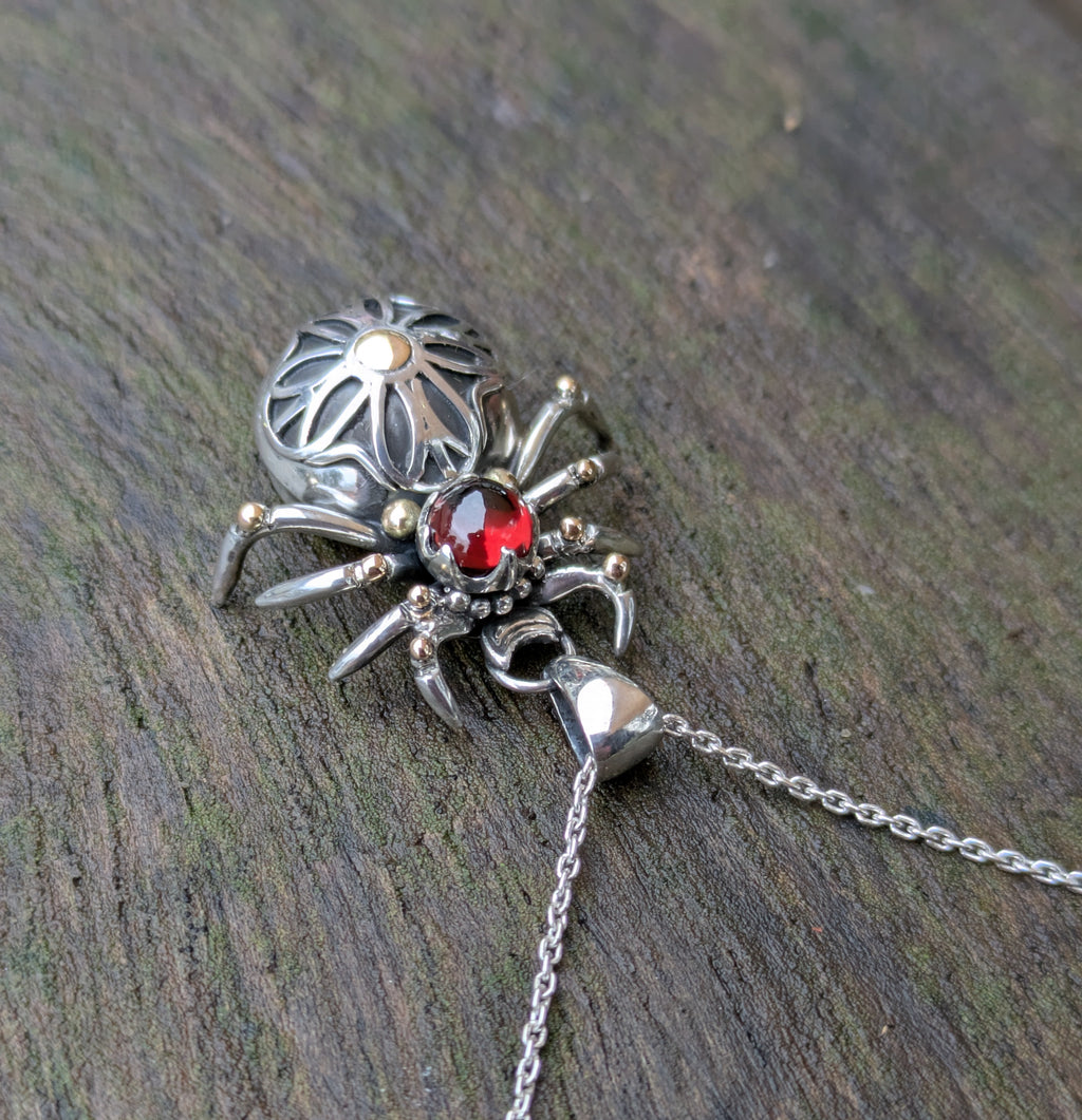Garnet, Sterling Silver and 9ct yellow Gold spider pendant featuring gothic rose window inspired design.