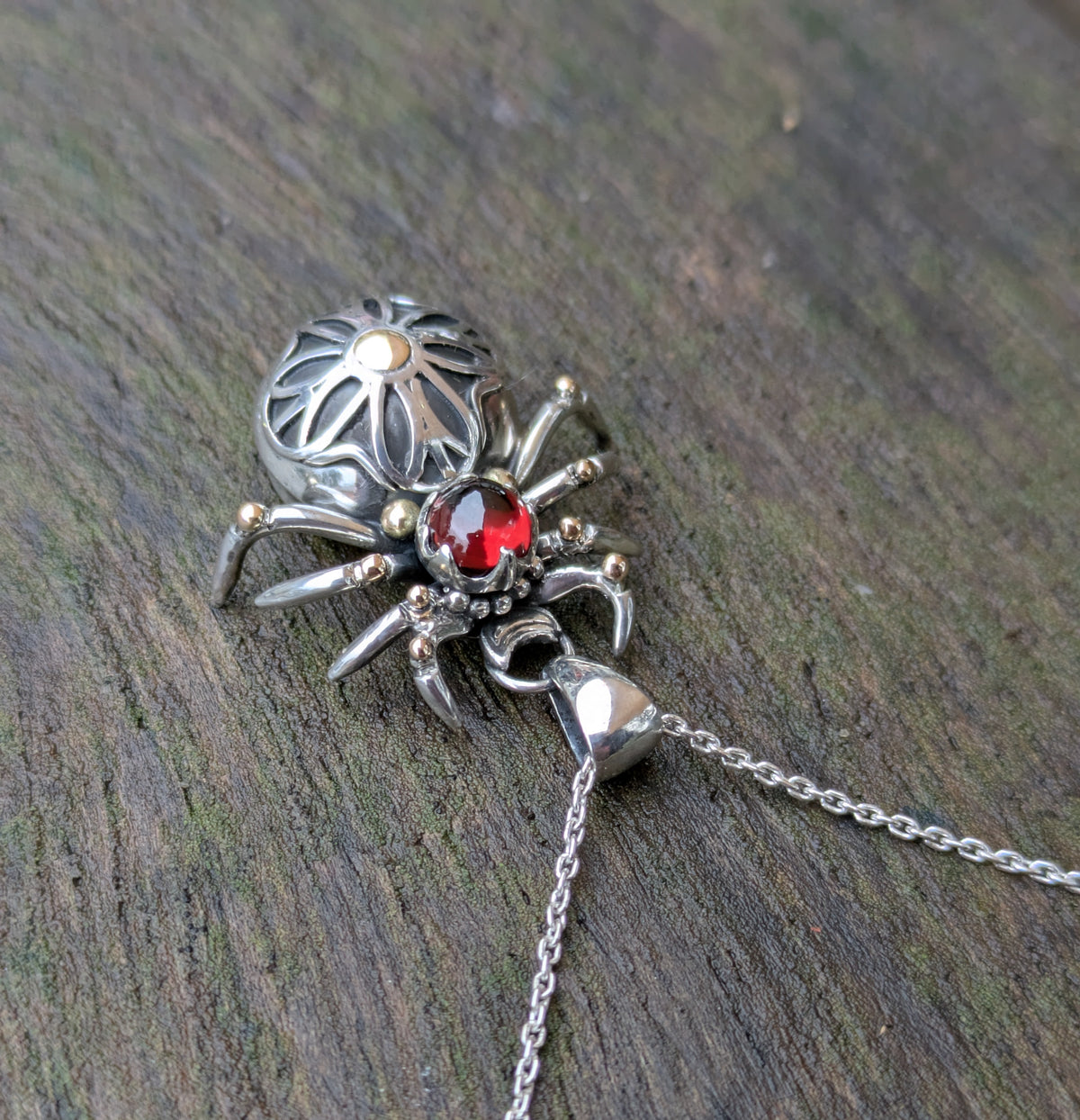 Garnet, Sterling Silver and 9ct yellow Gold spider pendant featuring gothic rose window inspired design.