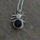 Beneath this gothic rose window inspired spider pendant made from Sterling Silver and 9ct yellow Gold there is a hidden gem- a beautiful black onyx cabochon.
